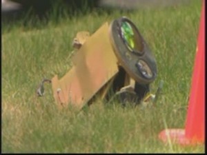 Police helicopter camera falls off hits cars