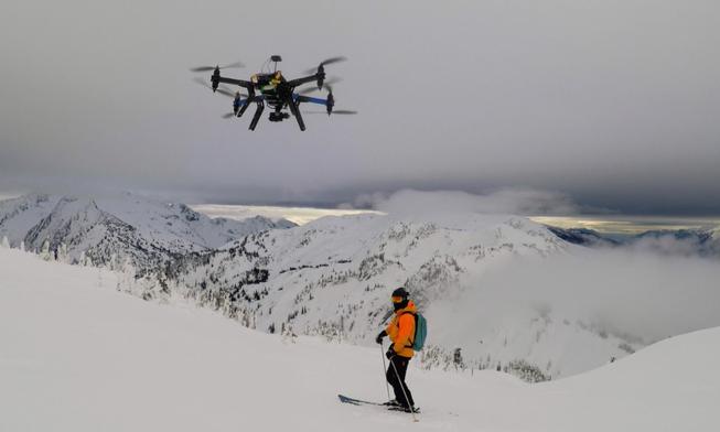 Cape drone autonomously filming with and flying a heli ski guide at CMH Heli Skiing in Revelstoke, Canada.  Photo provided by Cape